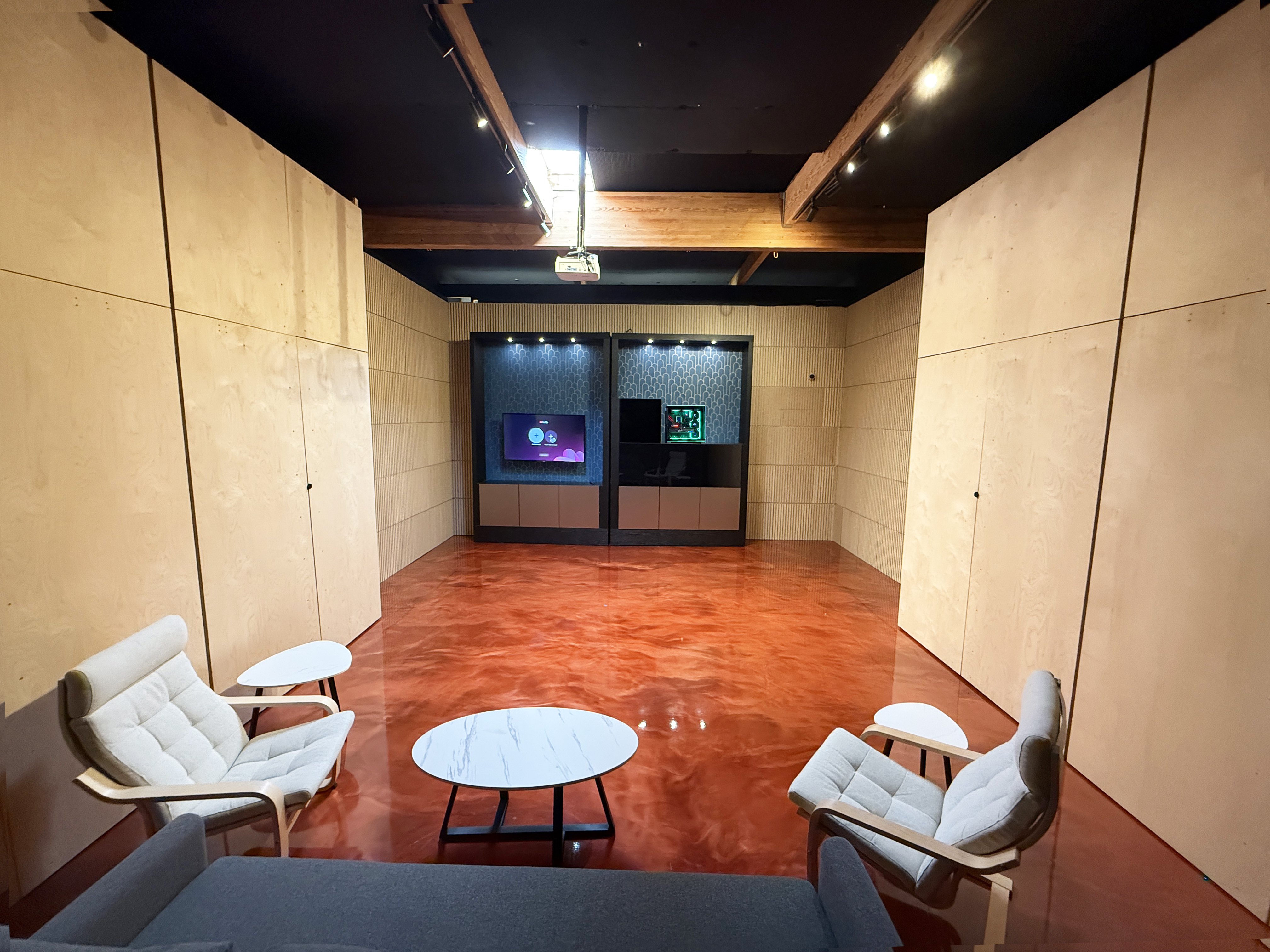 Luxury transforming indoor golf enclosure closed to create a beautiful living room with hidden golf simulator.